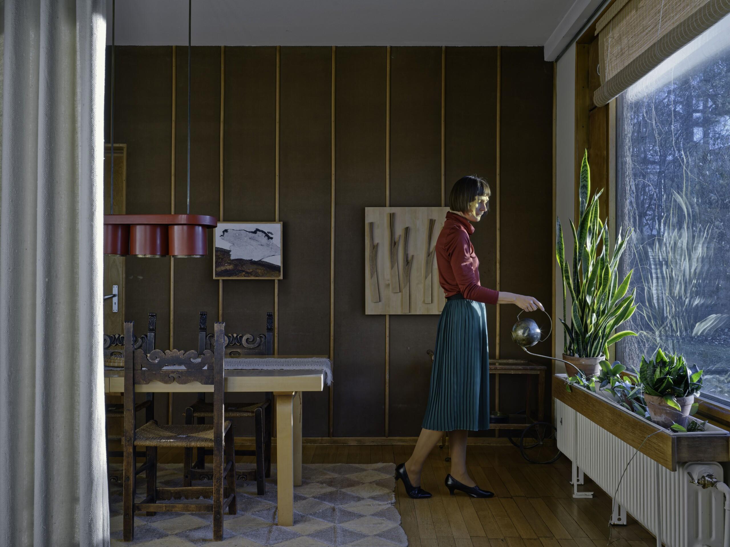 Elina Brotherus, Watering plants from the series In the Architect’s House, 2020